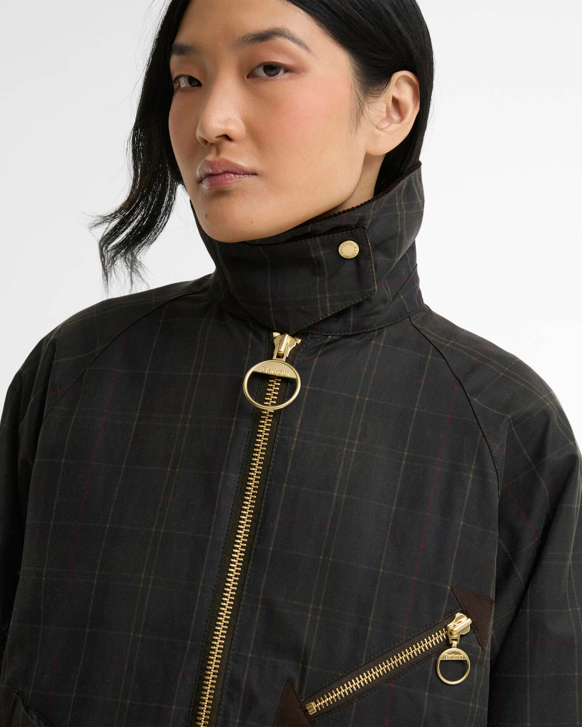 zipper detail of the Barbour Arlene Checked Waxed Jacket for women in Classic Shadow Classic