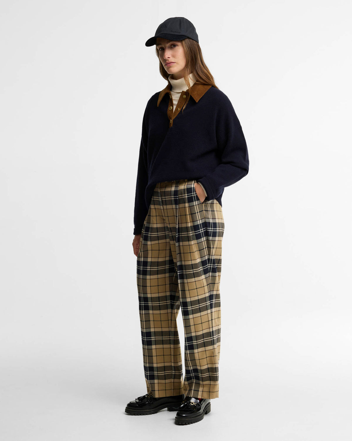 model wearing the Barbour Ravenshill Polo Jumper in Navy women’s merino wool sweater